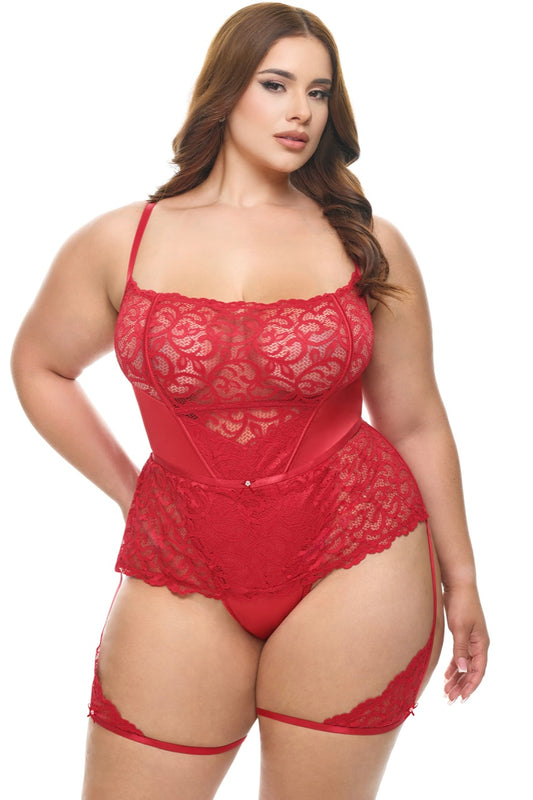 Woman wearing a red lace lingerie set on a white background