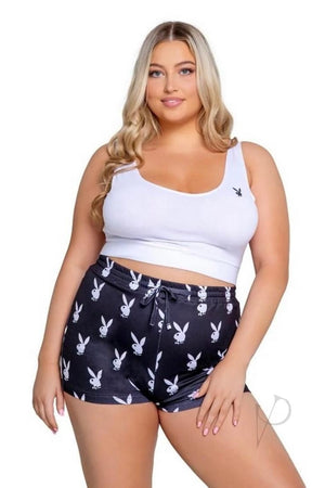 Woman wearing a white tank top and black shorts with bunny print on a white background