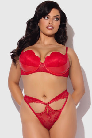 Woman wearing a red lingerie set on a white background